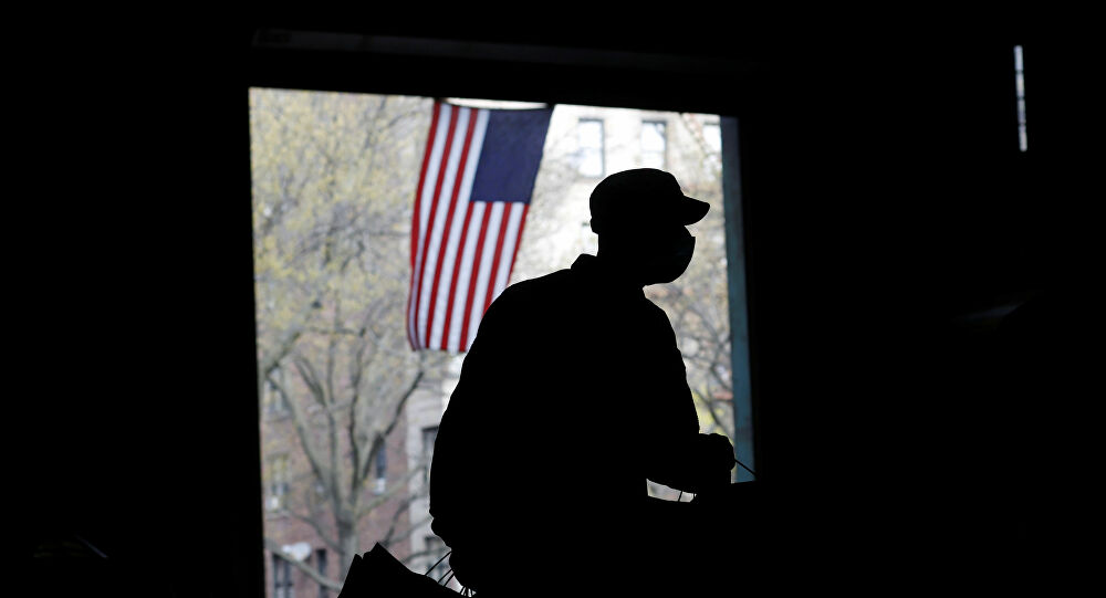 A U.S. Army National Guard soldier wears a protective face mask while working to load food into vehicles at the Kingsbridge Armory which is being used as a temporary food distribution center during the outbreak of the coronavirus disease (COVID-19) in the Bronx borough of New York City, New York, U.S., April 21, 2020