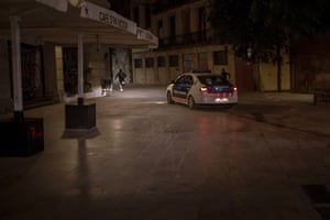 People run away from police after curfew in Barcelona, Spain