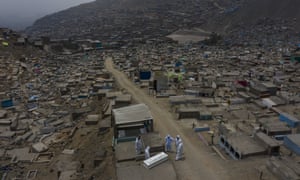 People carry a coffin at the Martires 19 de Julio cemetery in Comas, on the outskirts of Lima, Peru