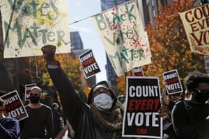 Demonstrators call for all votes to be counted during a rally outside the Pennsylvania convention centre in Philadephia