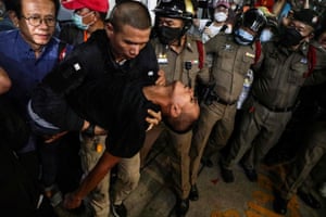 A pro-democracy activist is carried into a hospital vehicle in Bangkok, Thailand