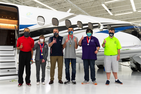 Textron Aviation President & CEO Ron Draper (pictured third from left) with Special Olympics Kansas athletes. (Photo: Business Wire)