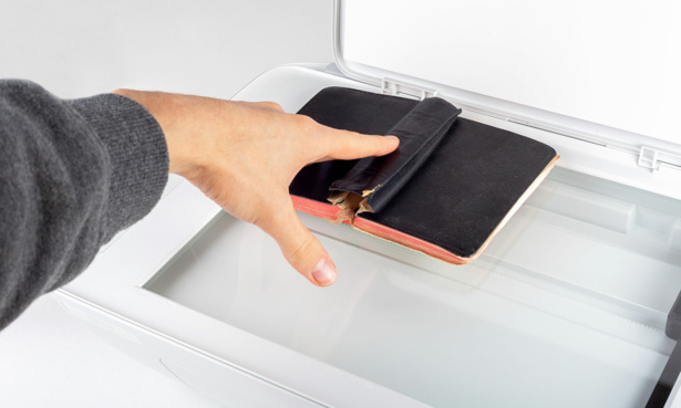 An all-in-one printer, with someone making a photocopy