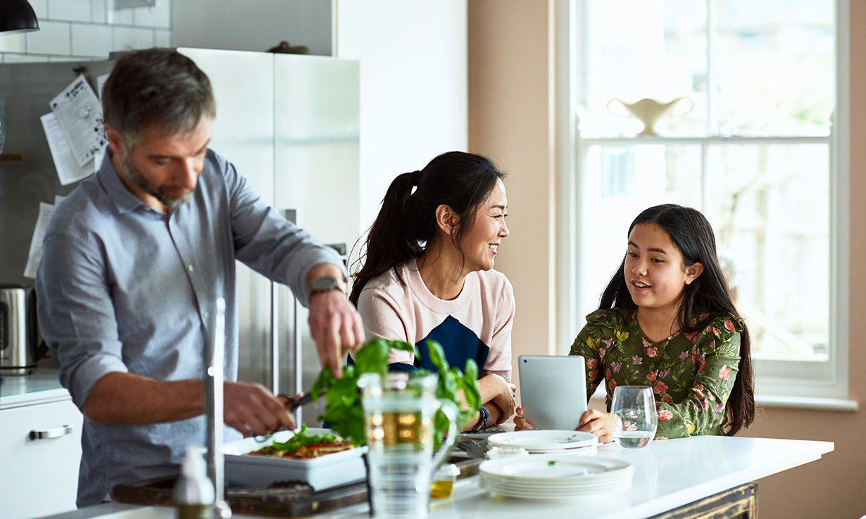 Family sitting around a kitchen table